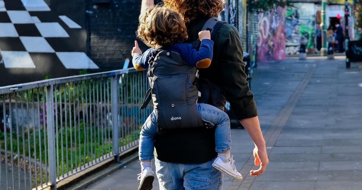 dad with toddler in diono 4-in-1 baby carrier