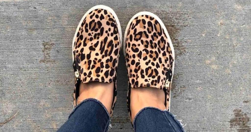 woman wearing dr. scholl's no chill sneakers in leopard print