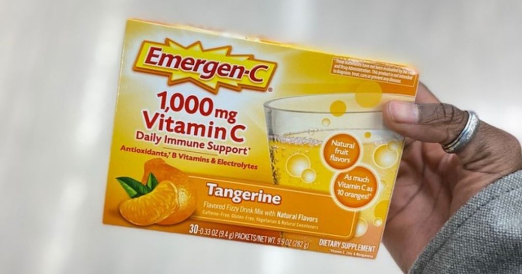 hand holding a 30-count box of Emergen-C Tangerine
