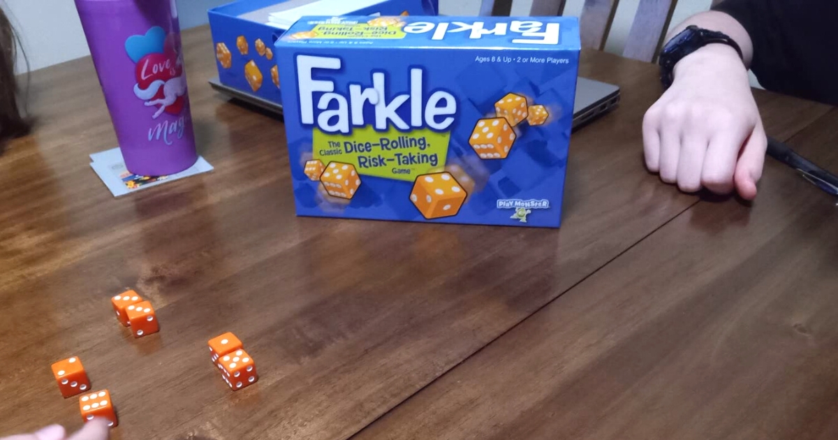Farkle classic dice game on a table with packaging