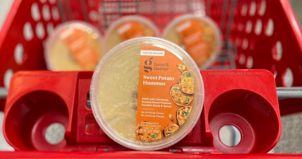 container of sweet potato hummus in store cart