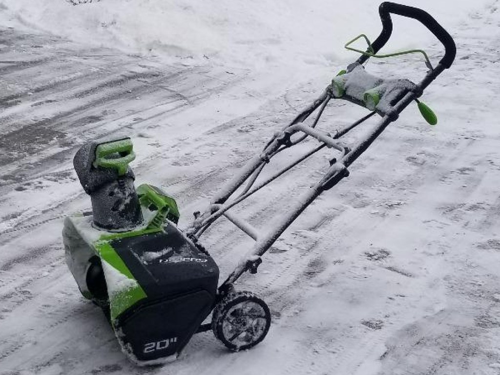 Greenworks Snow Blower on a driveway that has been freshly cleared of snow