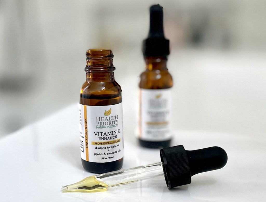 two bottles of vitamin 2 oil and dropper