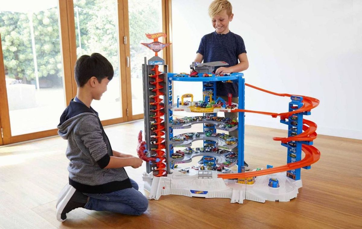 Kids playing with Hot Wheels Super Ultimate Garage Playset
