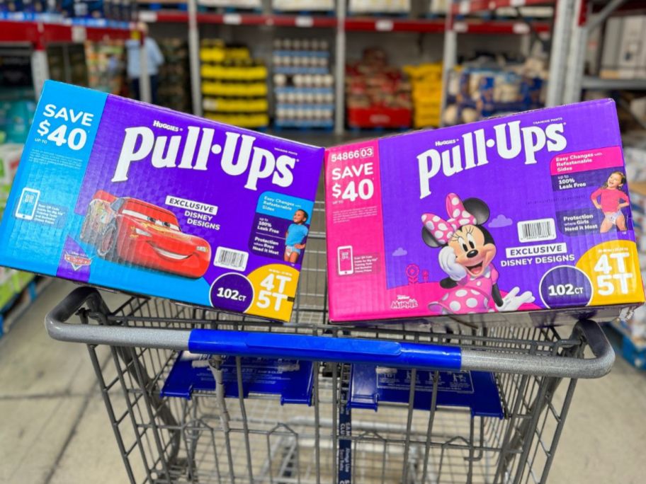 Sam's Club shoping cart with 2 big boxes of Huggies Pull-Ups in the front basket