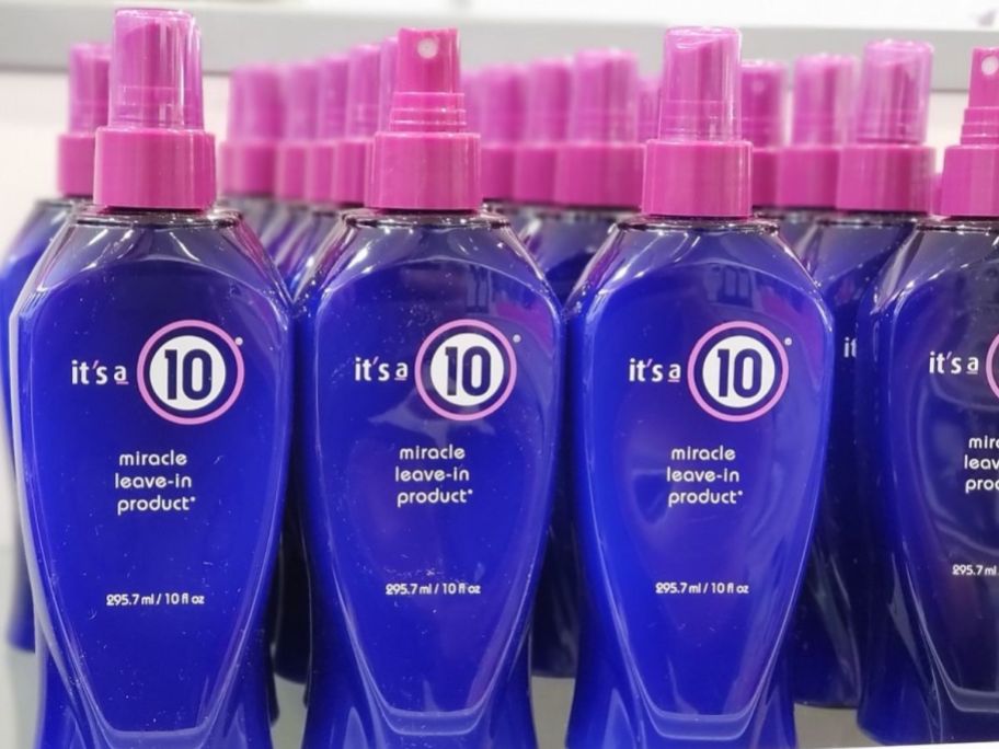 blue and purple bottles of It's a 10 Spray on store shelf