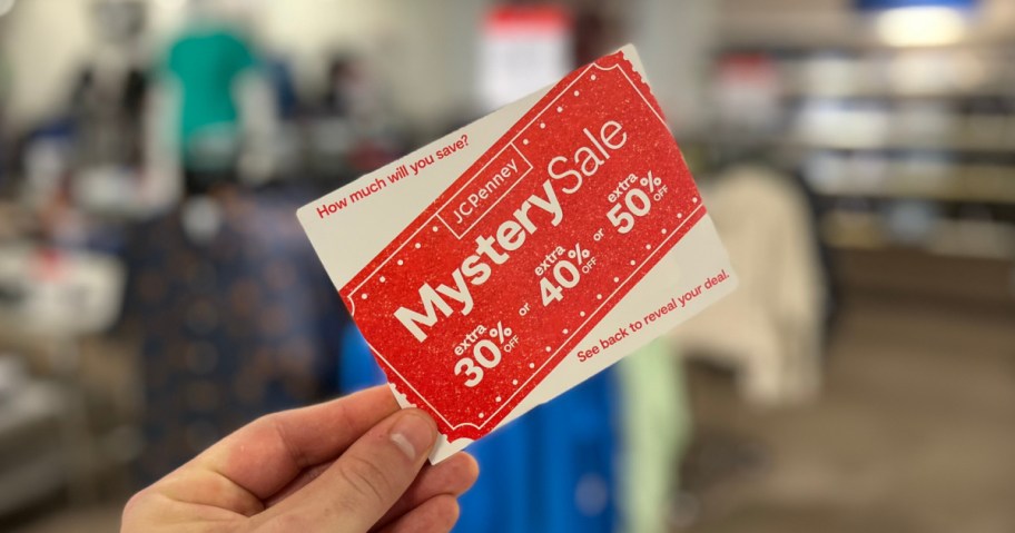 JCPenney Mystery Coupon Sale coupon in persons hand