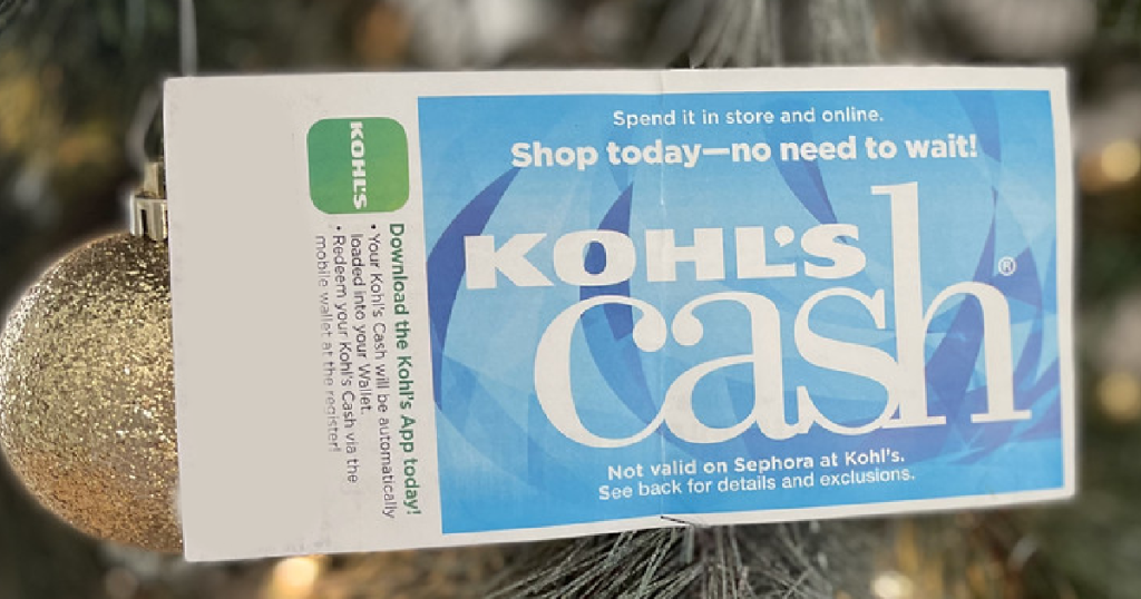 Kohl's Cash in front of Christmas tree