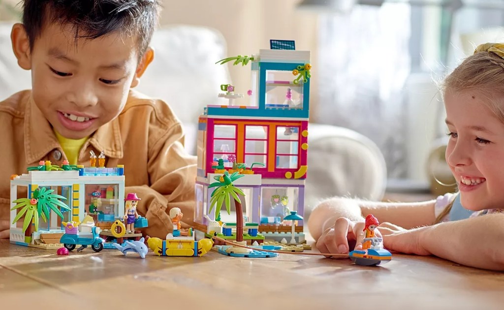 kids playing with the LEGO Friends Vacation Beach House Building Kit