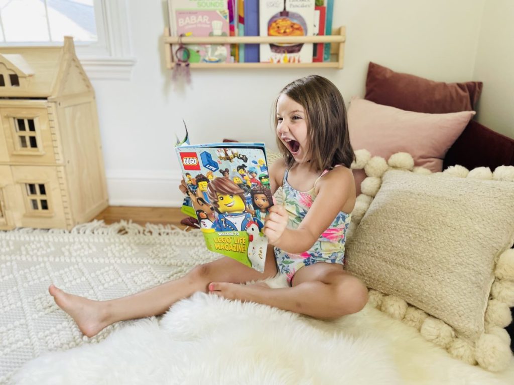 LEGO magazine with little girl