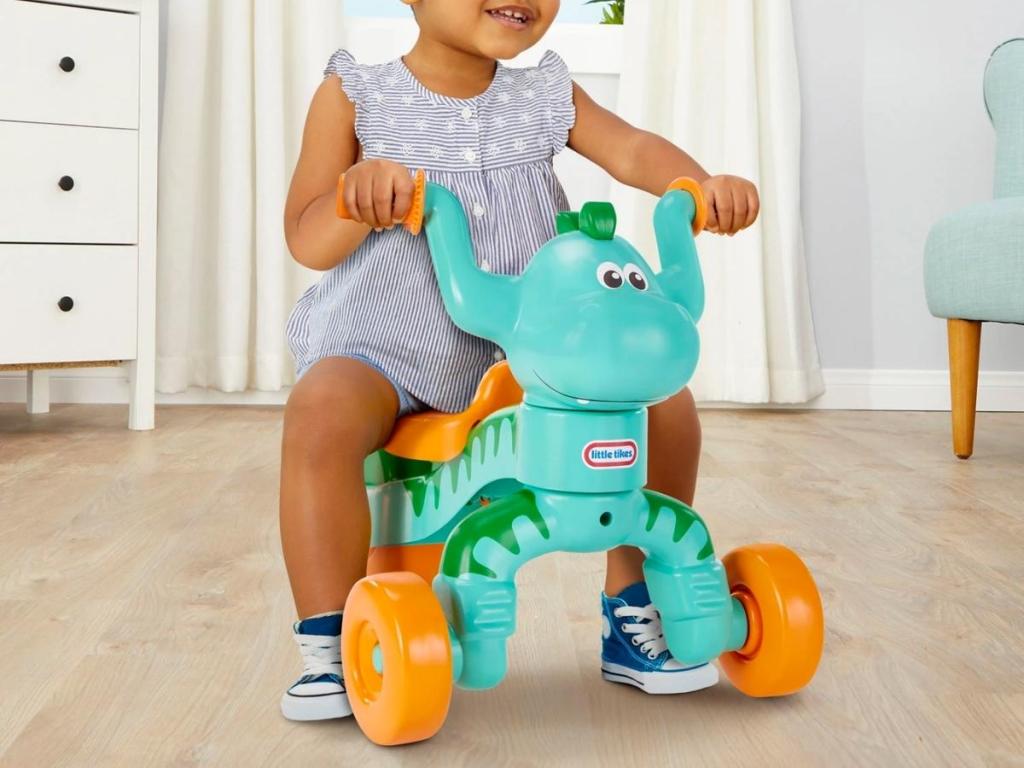child riding dino little tikes toy