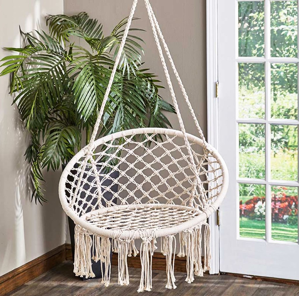 white macrame hanging chair