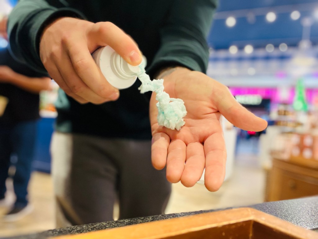 Man squirting Blue Shapeable Soap into hand