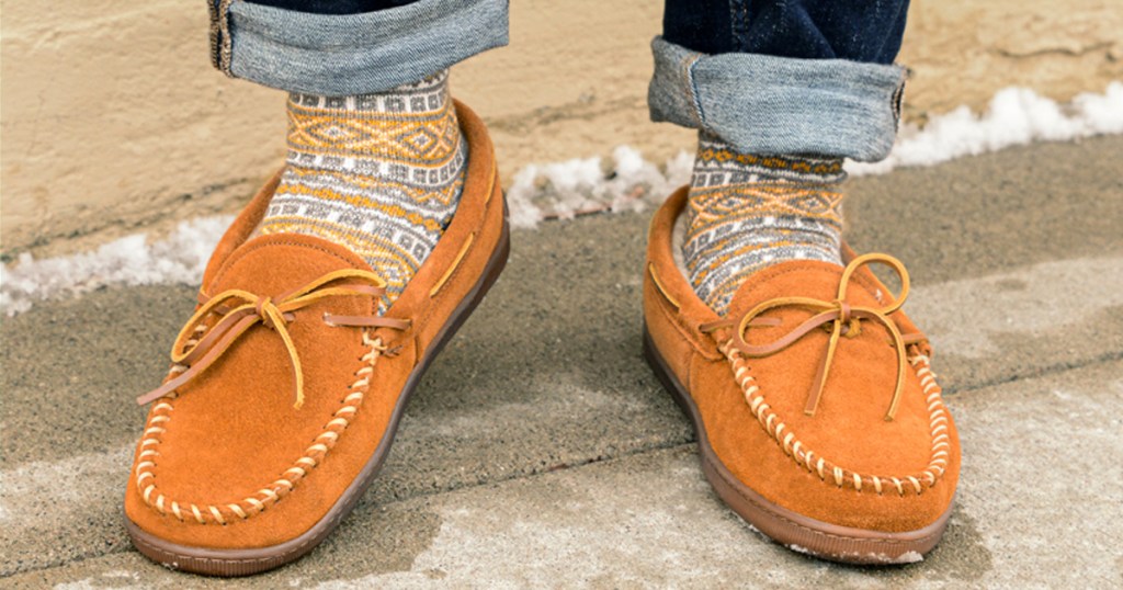 man wearing a pair of leather moccasins 