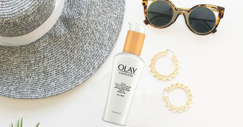 olay moisturizer near sunglasses, hat and earrings
