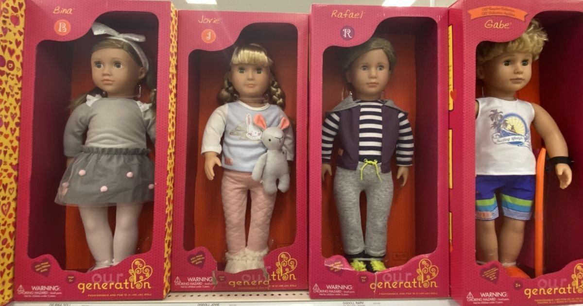 row of Our Generation dolls in boxes on store shelf