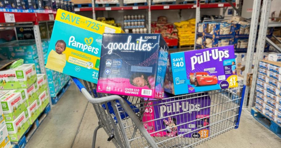 A Sam's Club shopping cart filled with boxes if Diapers and Training Pants