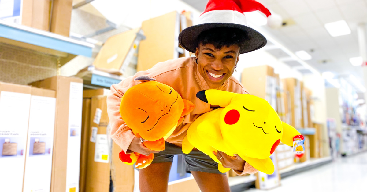woman holding 2 pokemon pillows