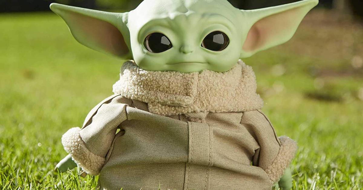 Star Wars The Mandalorian Grogu Plush Toy sitting outside in the grass