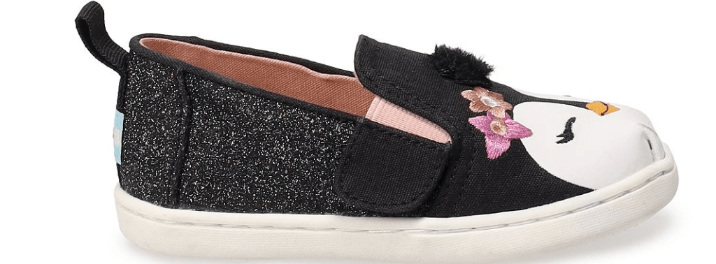 side view of a shoe with a penguin face on it