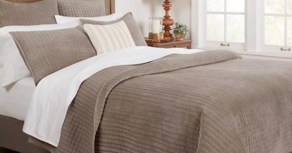 brown velvet comforter on bed 