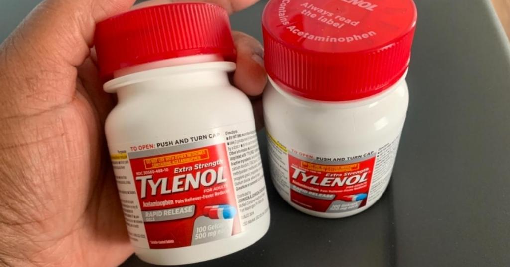hand holding bottle of tylenol extra strength rapid release gels 100 count