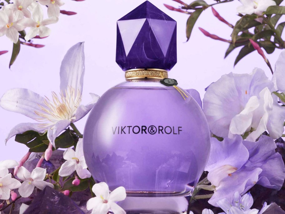 purple bottle of Viktor&Rolf Good Fortune Eau de Parfum surrounded by flowers