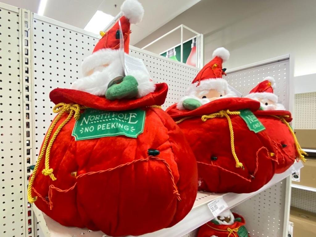wondershop santa and his toy bag decorative figurine on store shelf