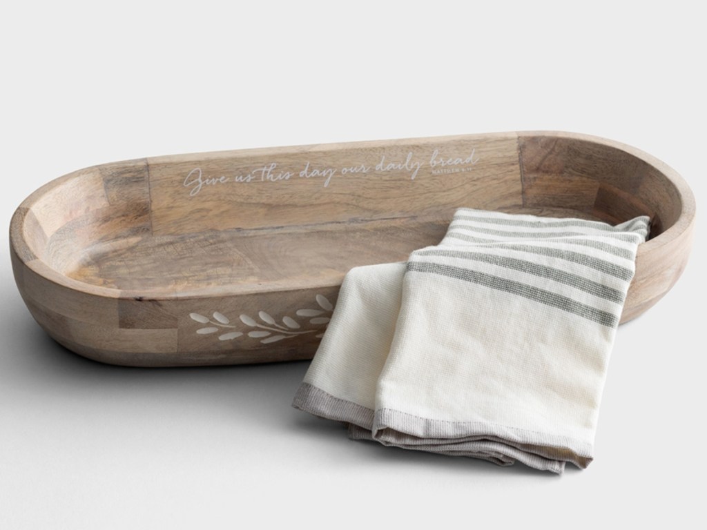 Wooden Dough Bowl with towel draped over the side