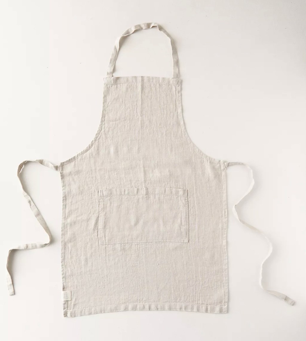 white linen apron on white background 