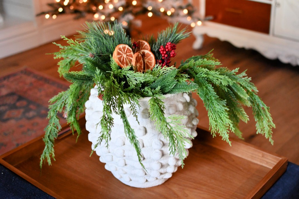 holiday stems in white planter