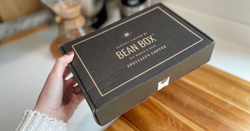 holding a Bean Box coffee subscription