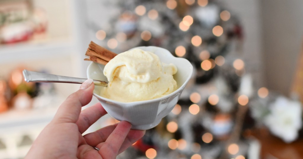 bowl of ice cream next to christmas tree