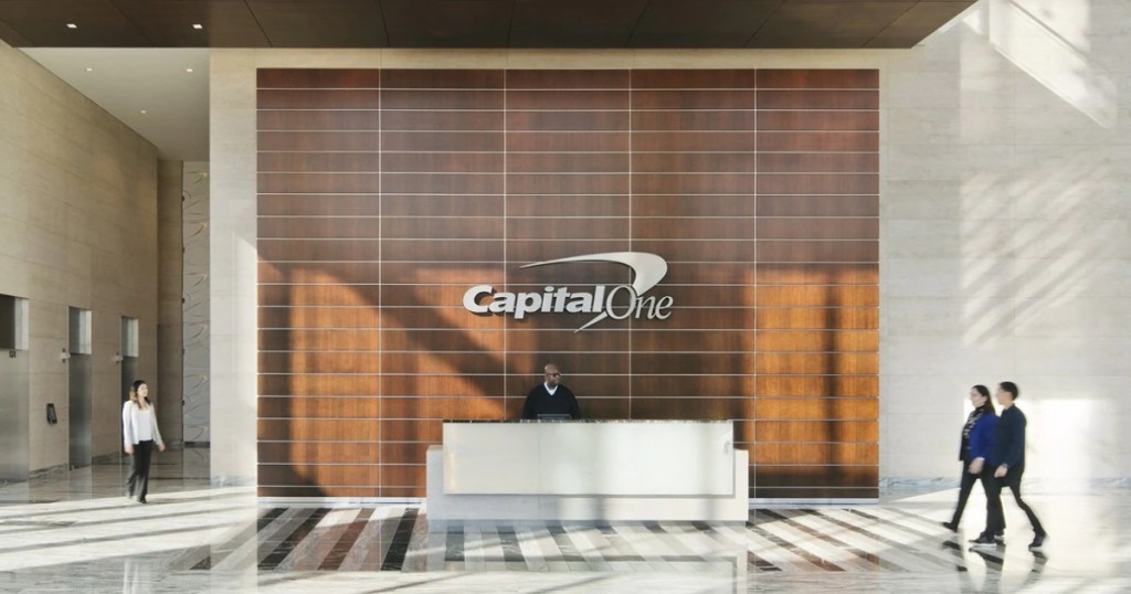 man working front dest at Capital One bank