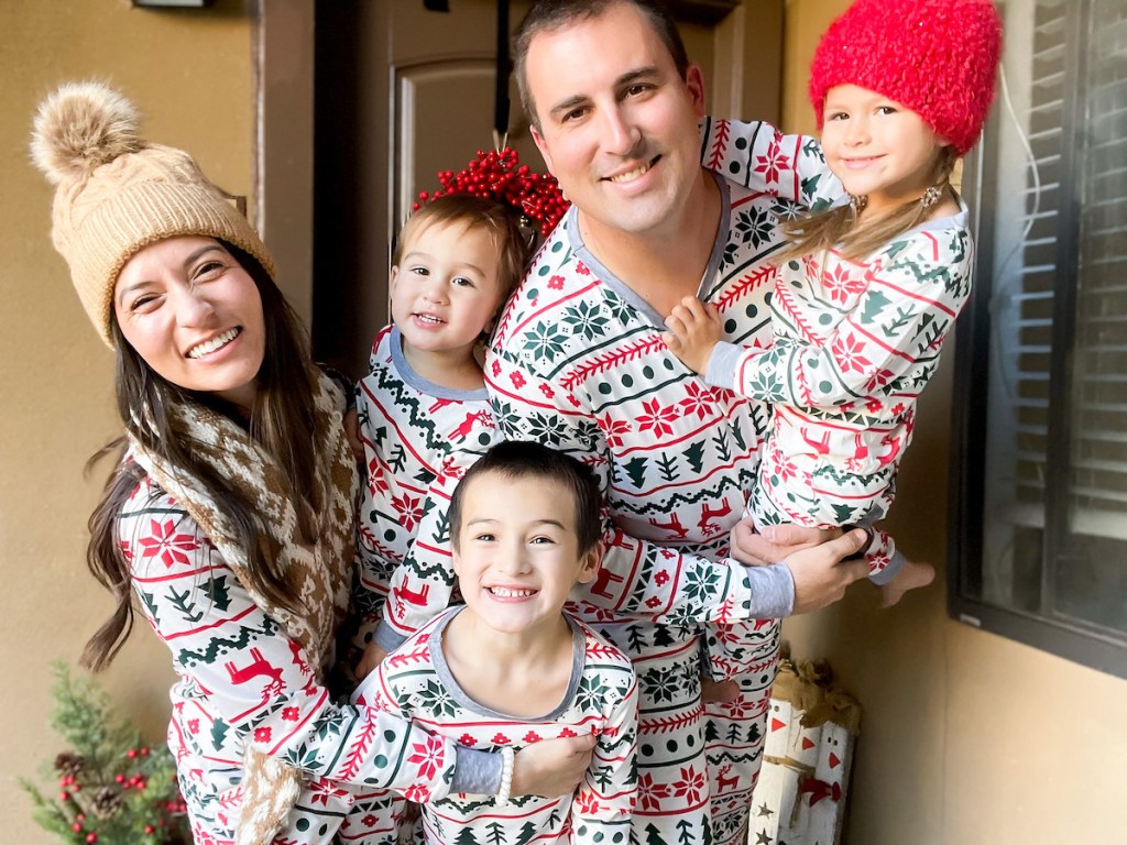family wearing matching christmas jammies