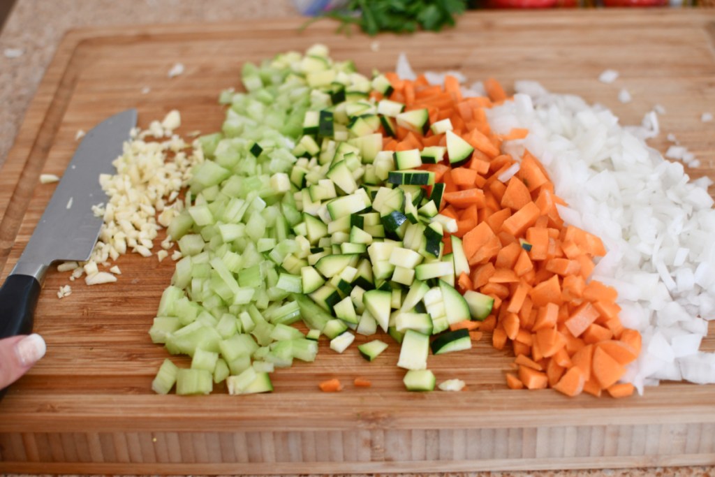 chopped veggies on a cutting board for soup