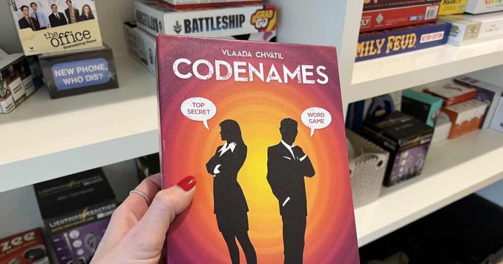 holding Codenames board game