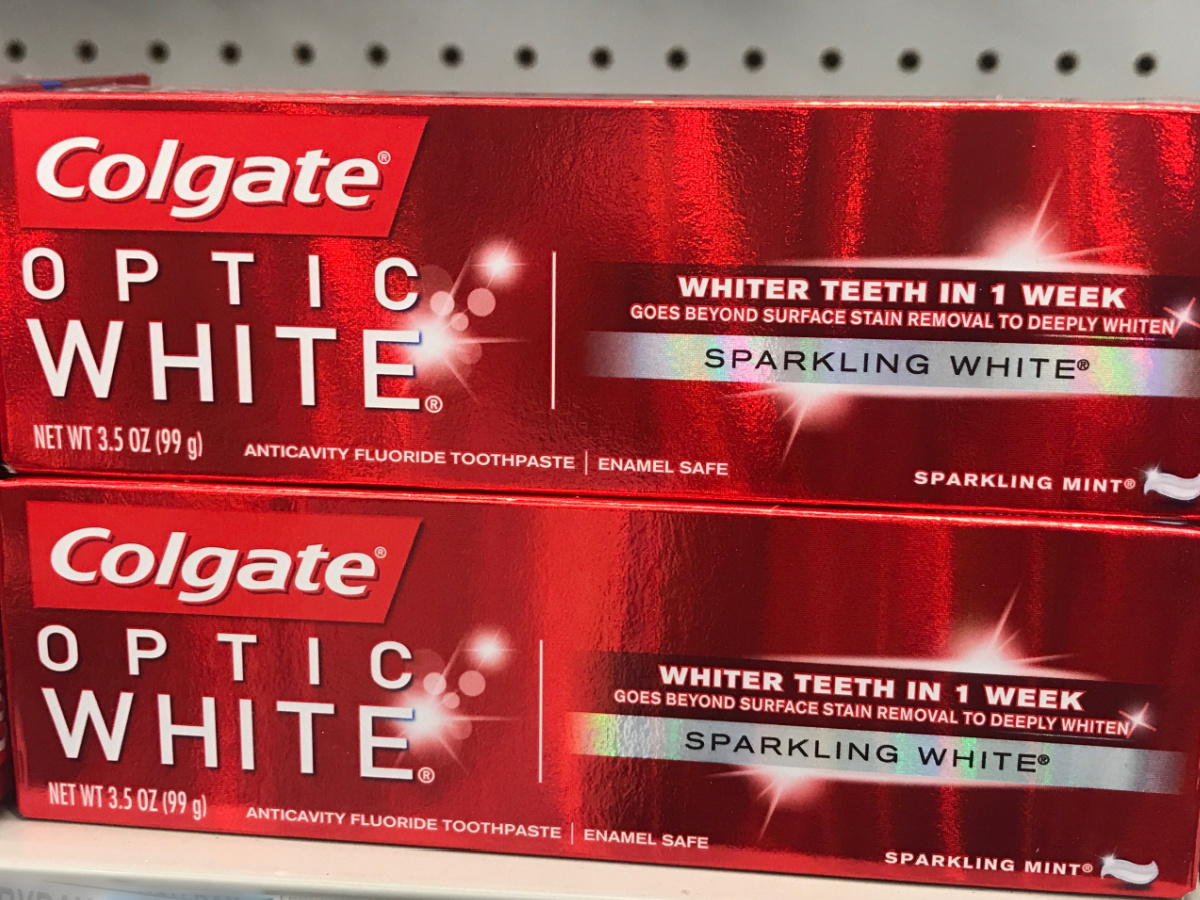 store shelf with 2 red boxes of Colgate brand toothpaste