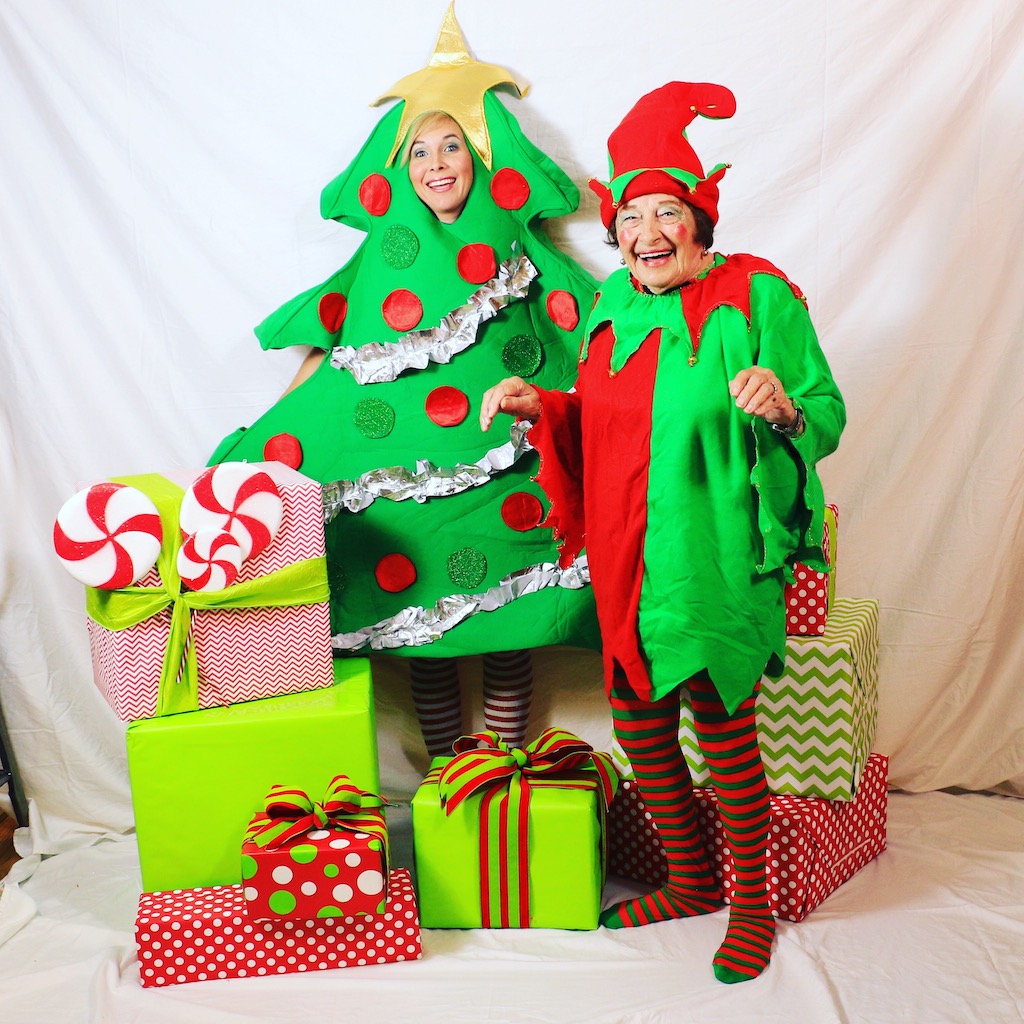Woman and grandmother dressed up in Christmas costumes 