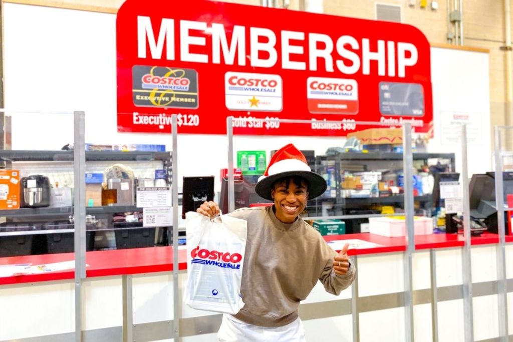 woman standing in front of Costco membership counter