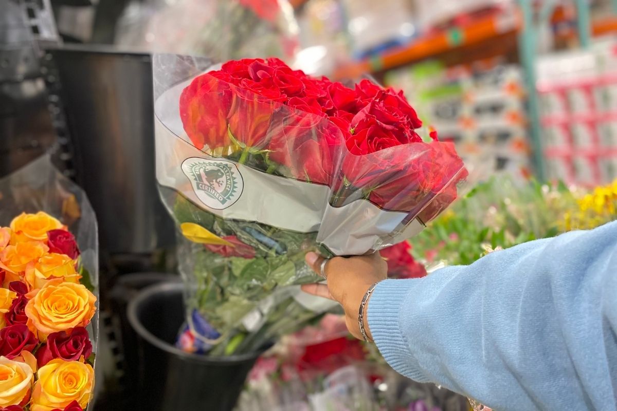 holding a bouquet of roses in Costco