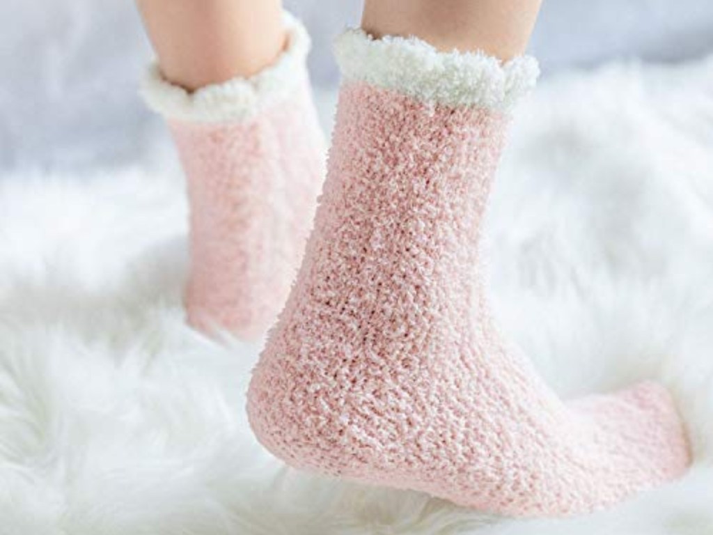 feet wearing pink cozy socks