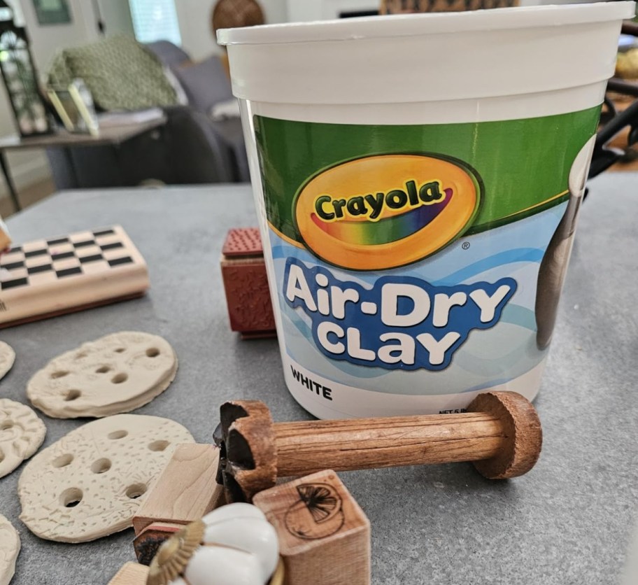 a 5 pound bucket of air dry clay on a kitchen counter