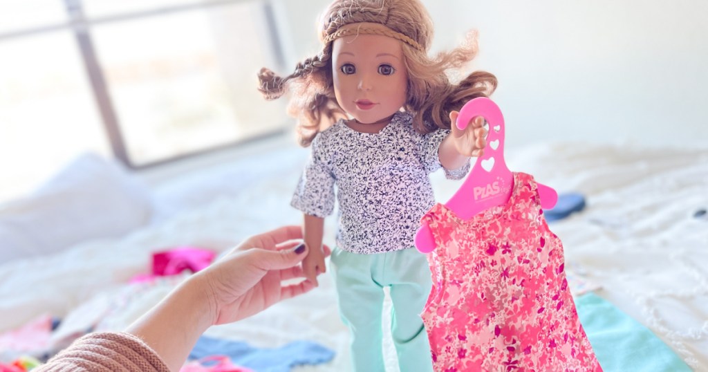 doll holding clothes