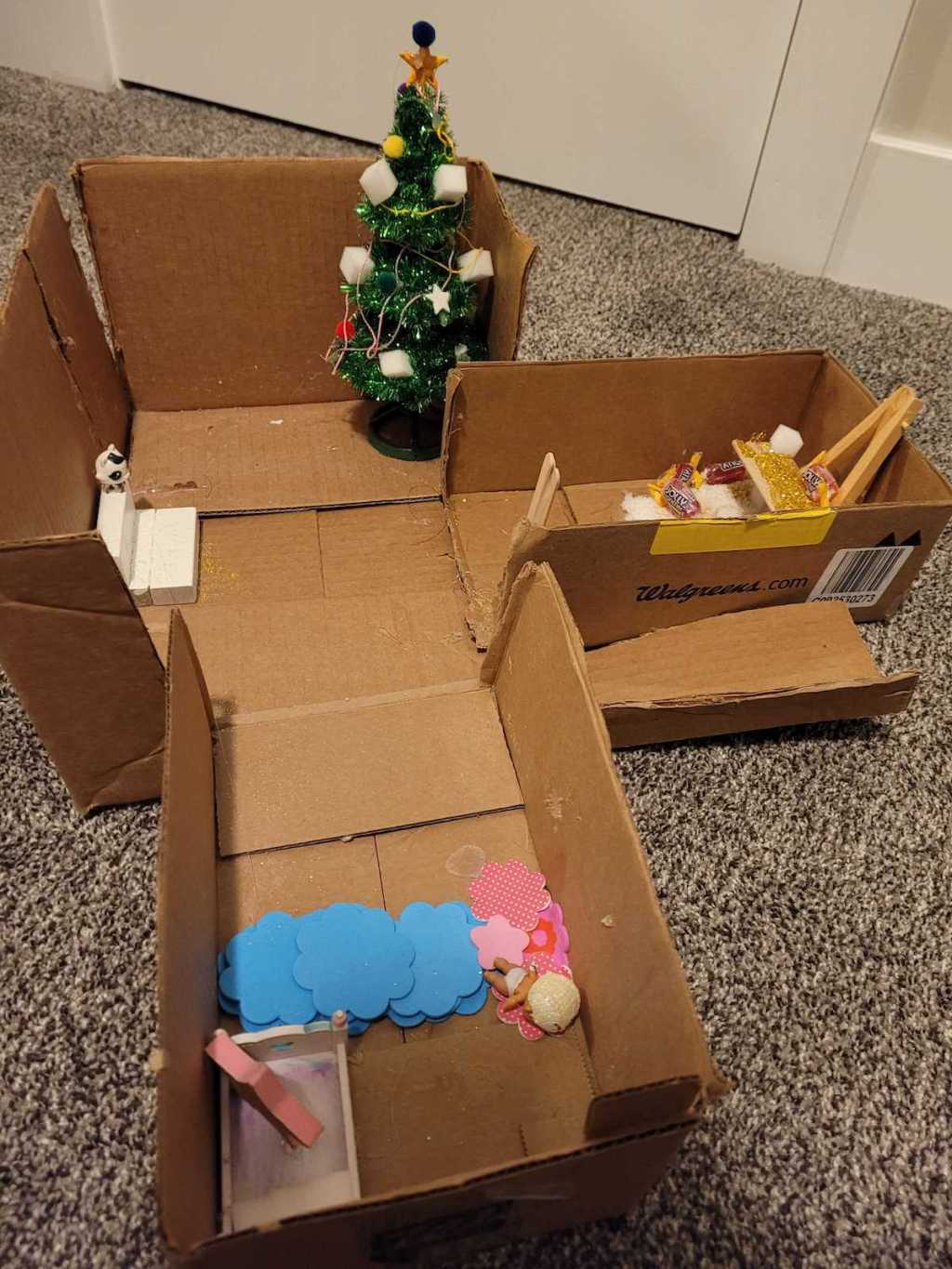 handmade cardboard box with christmas and house decorations