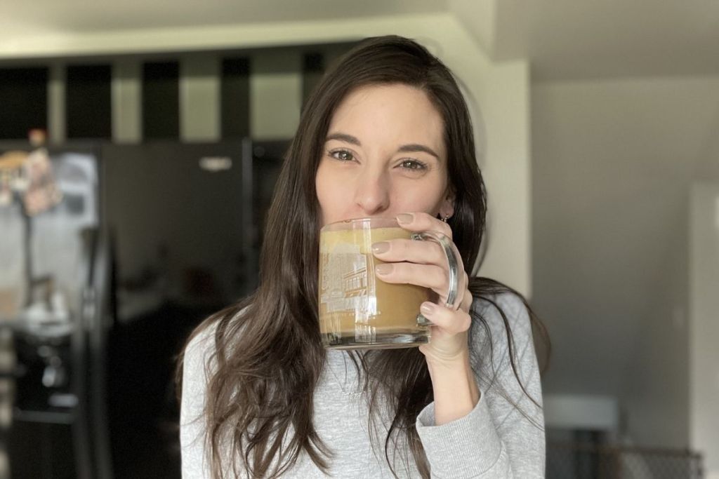 woman drinking a mushroom coffee cappuccino daily habits