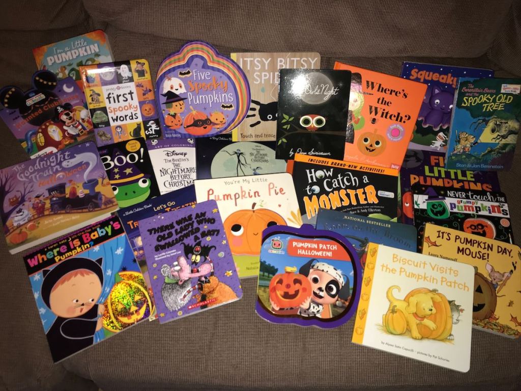 various halloween kids books on couch