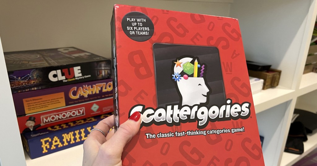 holding Scattergories board game 
