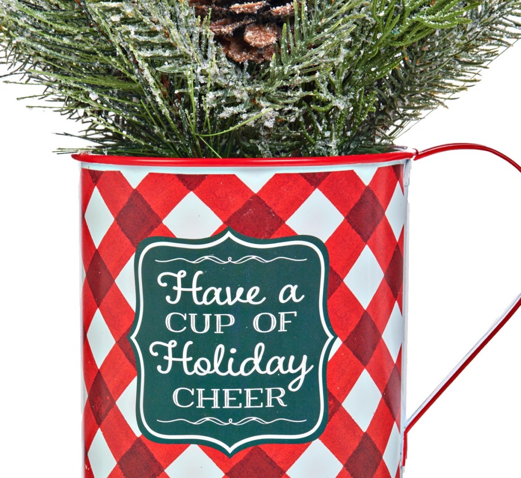 small pine tree in a christmas cup