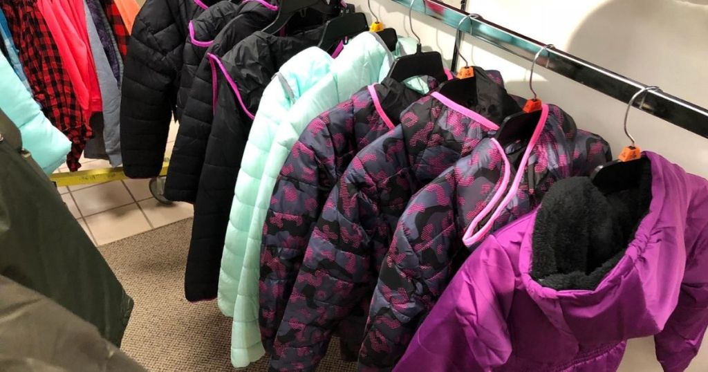 girl's jackets on rack in store